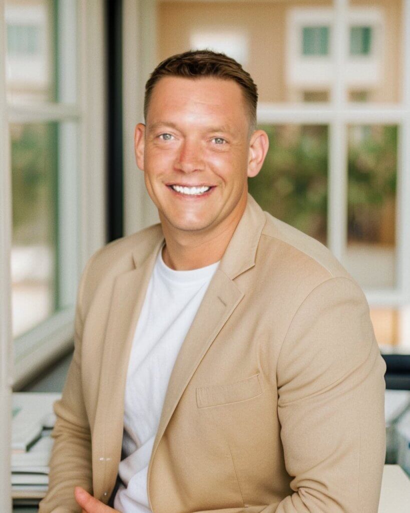 A military relocation professional is sitting in the sun room of a new home
