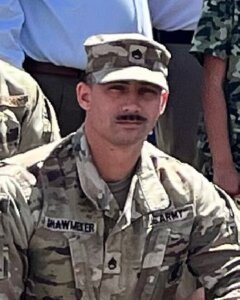 A uniformed soldier who received military family support when finding a new home