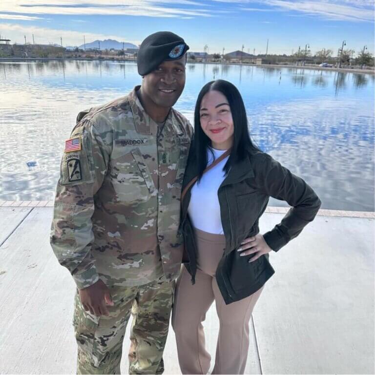 A uniformed soldier and his partner who found a home using the military family support offered by Armed Forces Across America